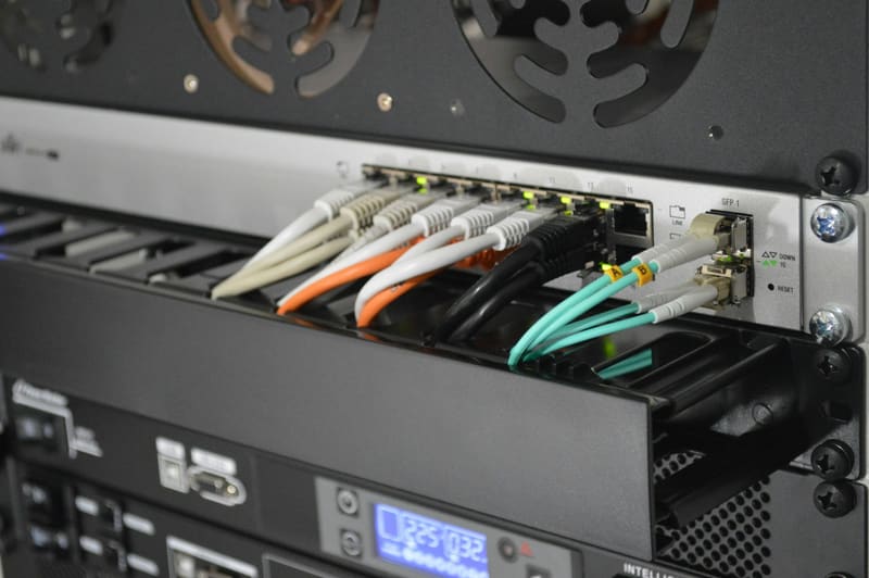 Close-up of a network switch with colored patch cables